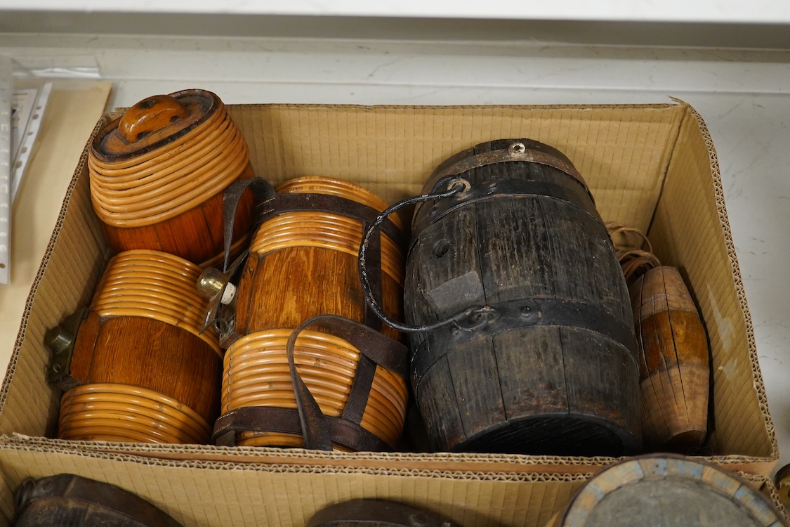 A collection of 19th and 20th century Costrels, some coopered oak, largest 27cm wide